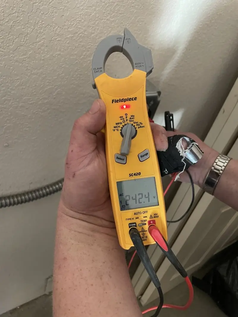 Voltage testing with clamp meter during Ceiling Fan Installation in South Windsor